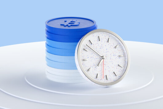 Pile of Bitcoin next to a clock to symbolise a crypto economic calendar