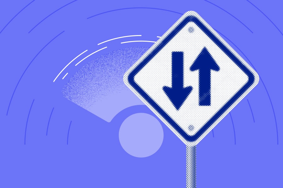 Two-way street symbol on a sign post